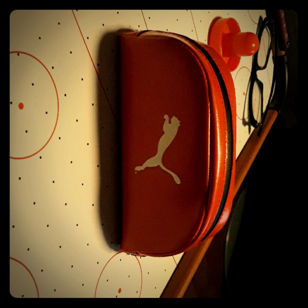 Red Puma sunglass case